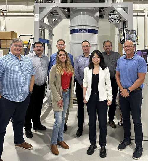 OI NanoScience and Lake Shore team in front of the Triton system in Lake Shore's factory in Westerville, Ohio